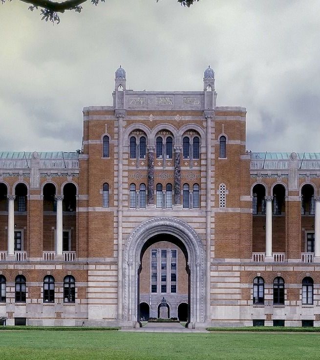 A large brick building with arches and columns